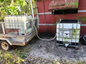transfer water from trailer to shed tank.